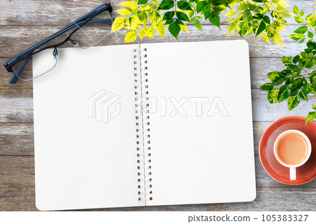 Blank notebook with hand and coffee cup 105383327