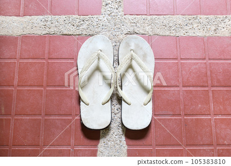 Close up white sandal on floor Close up white sandal on floor 105383810