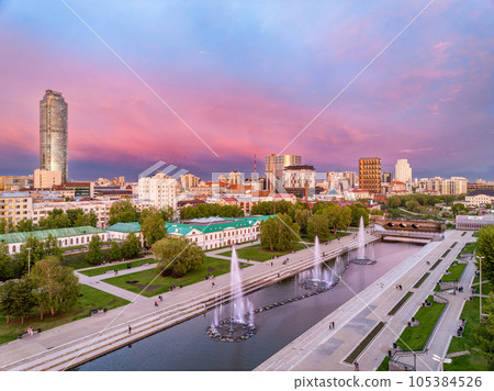 Embankment of the central pond and musical fountain. The historic center of the city of Yekaterinburg, Russia, Aerial View Embankment of the central pond and musical fountain. The historic center of the city of Yekaterinburg, Russia, Aerial View 105384526