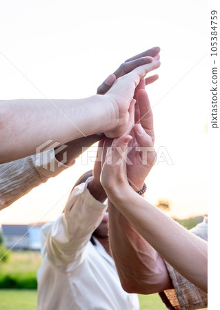 Diverse multiracial cheerful students giving high five greeting each other. Multi-ethnic millennial 105384759