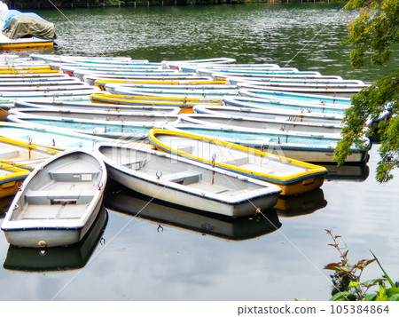Many rowing boats floating on the water Many rowing boats floating on the water 105384864