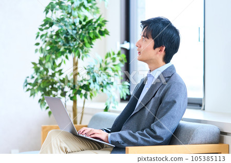 Young man in business casual free address lobby 105385113