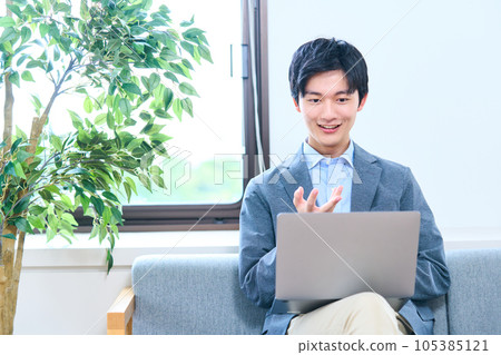 Young man in business casual Zoom meeting class Young man in business casual Zoom meeting class 105385121
