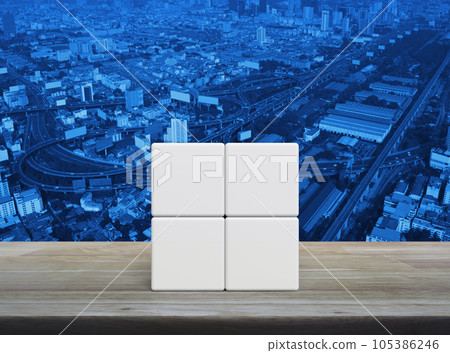 Four white block cubes on wooden table 105386246