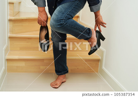 Asian business woman pain ankle, foot with leg cramp and fall down the stairs because slippery surfaces in office. Asian business woman pain ankle, foot with leg cramp and fall down the stairs because slippery surfaces in office. 105387354