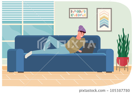 Man is lying and using laptop to chat. Guy spends time at computer for communication, chatting Man is lying and using laptop to chat. Guy spends time at computer for communication, chatting 105387780