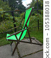 Relax and unwind in style with our exquisite wooden recliner chair featuring lush green fabric. 105388038