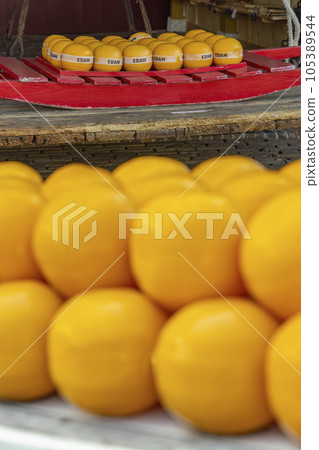 Detail of edam cheeses, town cheese market, Edam, North Holland, Netherlands Detail of edam cheeses, town cheese market, Edam, North Holland, Netherlands 105389544