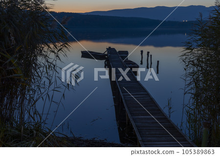 fishing boat at pier on Jenoi pond near Diosjeno, Northern Hungary 105389863