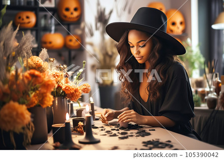 Attractive african american woman florist working in flower shop. Creation of autumn decor for Halloween celebration 105390042