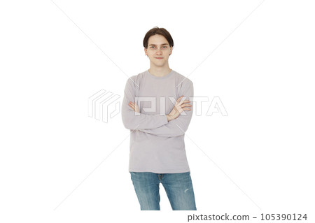 Happy young man with crossed hannds posing standing isolated on white background 105390124