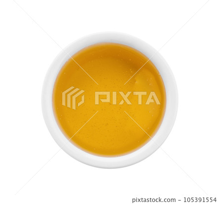 Bowl of organic honey isolated on white, top view Bowl of organic honey isolated on white, top view 105391554