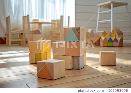 Colorful wooden toy blocks on wooden table in the Children's room. 105393096