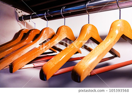 wooden hangers in the closet wooden hangers in the closet 105393568