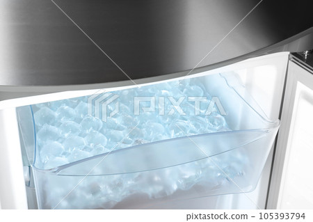Plastic bags with ice cubes in fridge 105393794