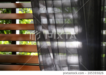 Window with beautiful curtain and blinds, closeup 105393826