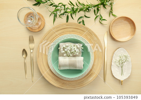 Elegant table setting with flowers and leaves, flat lay Elegant table setting with flowers and leaves, flat lay 105393849