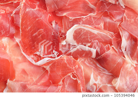 Tasty prosciutto slices as background, top view Tasty prosciutto slices as background, top view 105394046