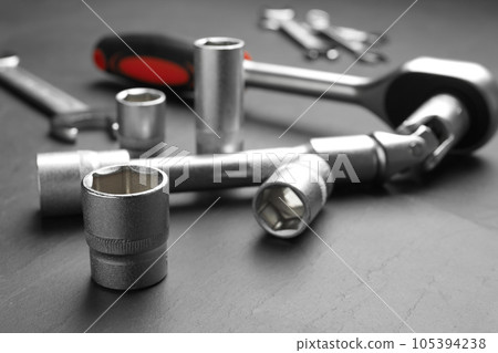 Auto mechanic's tools on grey background, closeup 105394238