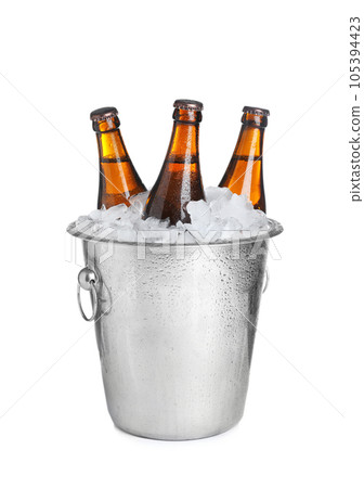 Beer in metal bucket with ice isolated on white 105394423