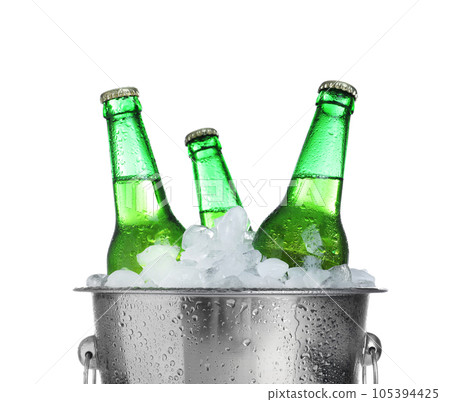 Beer in metal bucket with ice isolated on white Beer in metal bucket with ice isolated on white 105394425