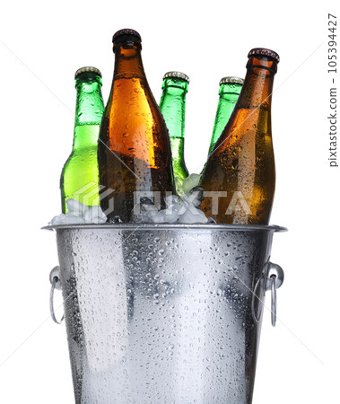 Beer in metal bucket with ice isolated on white 105394427