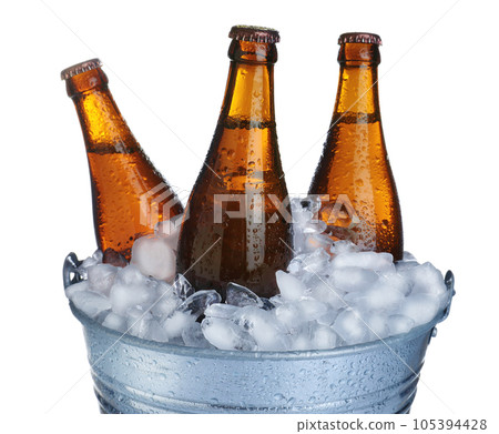 Beer in metal bucket with ice isolated on white 105394428