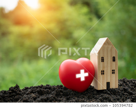 The concept of health insurance and medical welfare. Model wooden house and red heart with plus icon. Health insurance and access to health care. health care planning The concept of health insurance and medical welfare. Model wooden house and red heart with plus icon. Health insurance and access to health care. health care planning 105394782