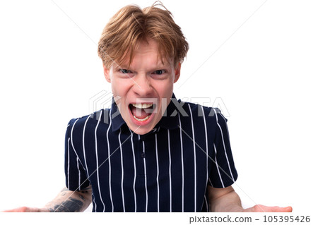 emotional 25 year old blond man in a striped polo screaming emotional 25 year old blond man in a striped polo screaming 105395426