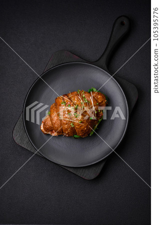 Delicious crispy croissant with salmon, lettuce, cheese and tomatoes 105395776