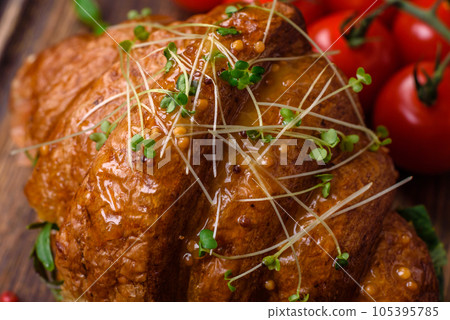 Delicious crispy croissant with salmon, lettuce, cheese and tomatoes 105395785