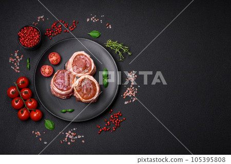 Delicious raw fresh pork or chicken meat rolls wrapped in bacon 105395808