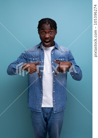 vertical portrait of handsome young stylish african man with curls in denim clothes vertical portrait of handsome young stylish african man with curls in denim clothes 105396274