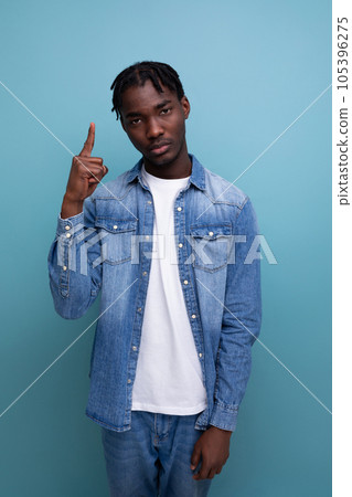 smart african man with dreadlocks on blue background 105396275