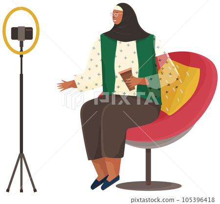 Muslim woman communicates with friends via video call. Lady recording podcast on smartphone Muslim woman communicates with friends via video call. Lady recording podcast on smartphone 105396418