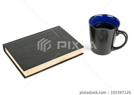 Book and a cup of coffee isolated on a white . Book and a cup of coffee isolated on a white . 105397126