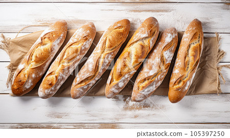 Freshly baked baguettes on white wooden background, top view. Generative AI 105397250