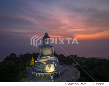 aerial view Phuket big Buddha in beautiful sunset..the sun shines through the clouds impact on ocean surface.The beauty of the statue fits perfectly with the charming nature..cloud scape background.. aerial view Phuket big Buddha in beautiful sunset..the sun shines through the clouds impact on ocean surface.The beauty of the statue fits perfectly with the charming nature..cloud scape background.. 105399942