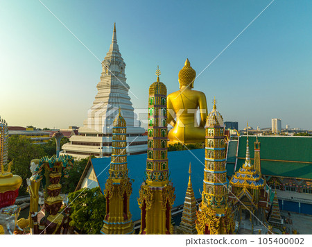 aerial view golden big Buddha Wat Paknam Phasi Charoen in sunset.  beautiful sunset reflection on a canal in front big buddha.  scenery sky in twilight background.the one famous landmarks in Thailand. 105400002