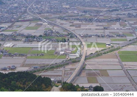 View from Mt. Monju towards the center of Fukui city Hokuriku Shinkansen under construction May 2023 105400444