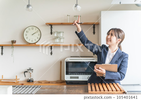 Asian business woman checking lighting, lights and light bulbs 105401641