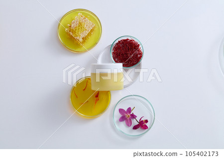 Crocus flowers, saffron and honeycomb placed on few petri dishes. Unbranded cosmetic jar displayed. Recent studies state that saffron has many medicinal properties Crocus flowers, saffron and honeycomb placed on few petri dishes. Unbranded cosmetic jar displayed. Recent studies state that saffron has many medicinal properties 105402173
