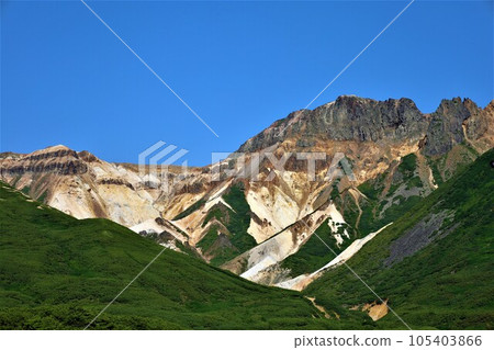 The peaks of Mt. Tokachi seen from Yumoto Ryounkaku of Tokachidake Onsen overlooking Mt. Tokachi, the majestic mountain of Hokkaido The peaks of Mt. Tokachi seen from Yumoto Ryounkaku of Tokachidake Onsen overlooking Mt. Tokachi, the majestic mountain of Hokkaido 105403866