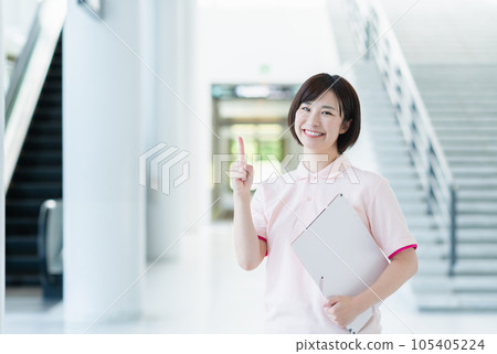 Young female caregiver working at a facility Young female caregiver working at a facility 105405224