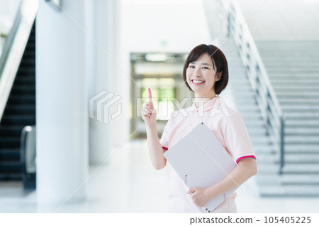 Young female caregiver working at a facility 105405225