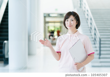 Young female caregiver working at a facility Young female caregiver working at a facility 105405307