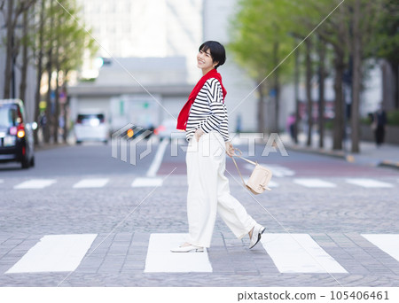 A woman walking in the city A woman walking in the city 105406461