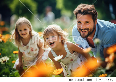 Family time spent in a flower-filled park 105408359