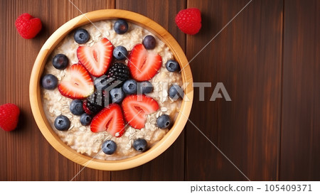 Healthy overnight oat topping with fresh fruit on table. 105409371