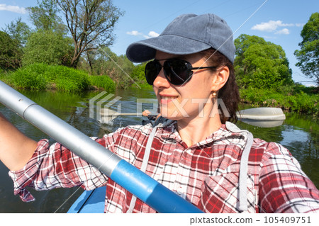 Man and woman couple, selfies are happy in family kayak trip rowing boat on the river, water hike, a summer adventure. Eco-friendly and extreme tourism, active and healthy lifestyle 105409751